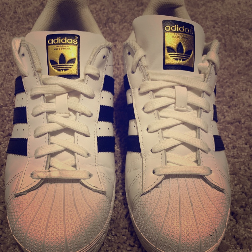 Black and white shell toe Adidas